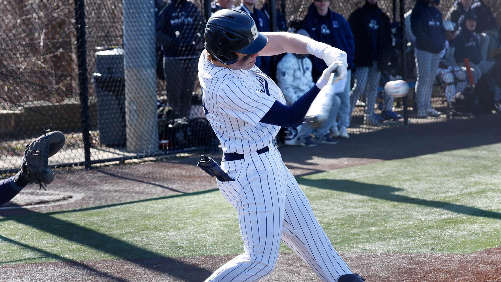 baseball player swinging bat