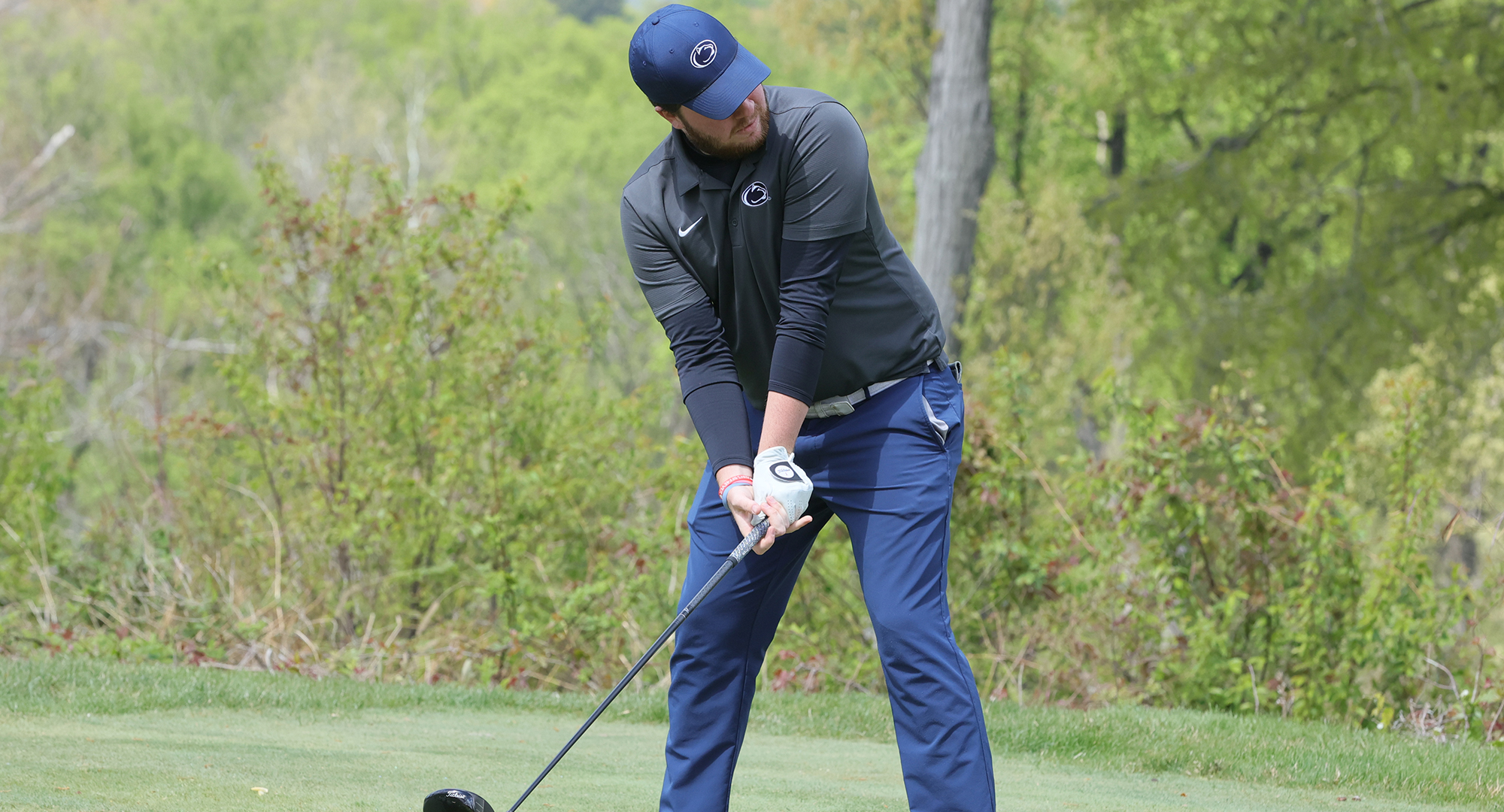 golfer readies to tee off