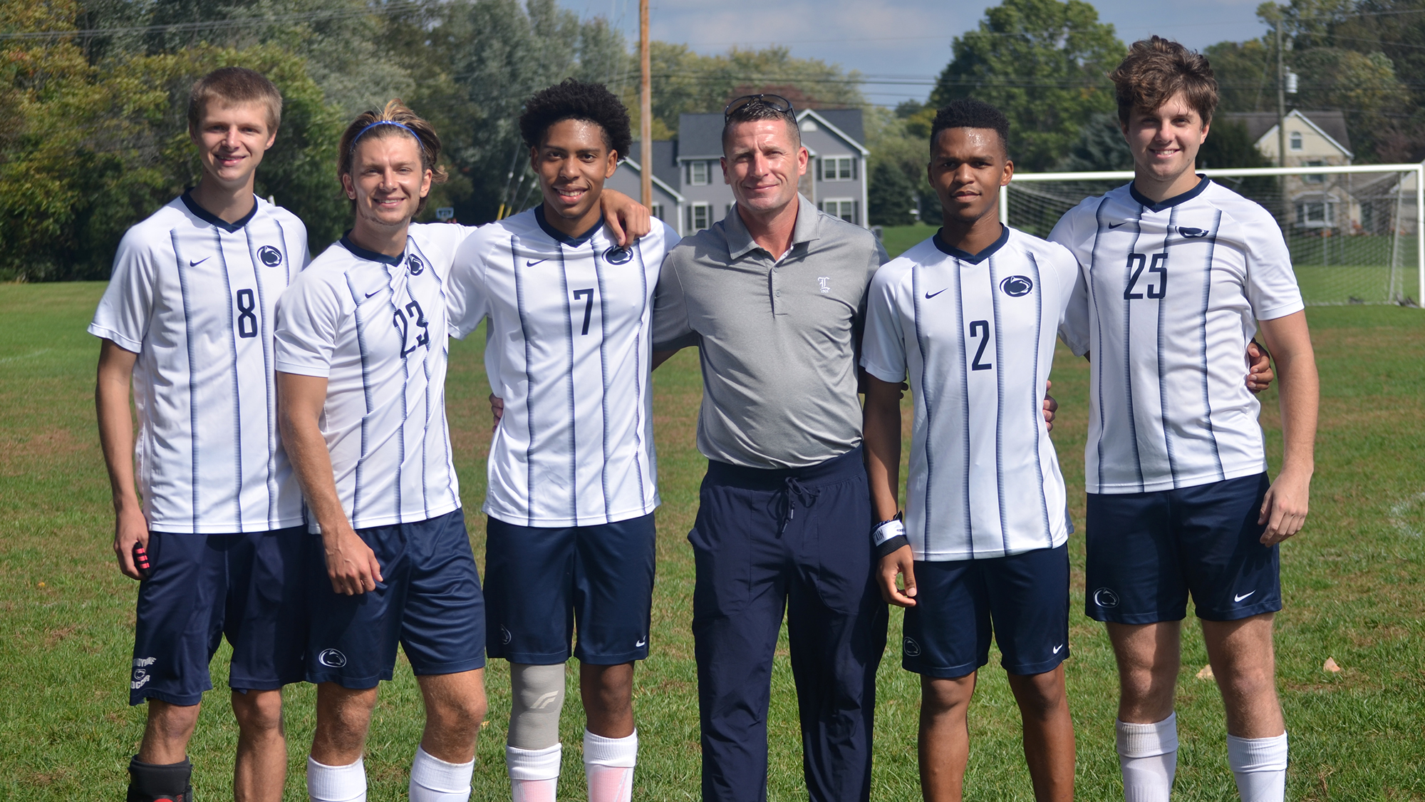 Men's soccer seniors with head coach Tom Greenawalt