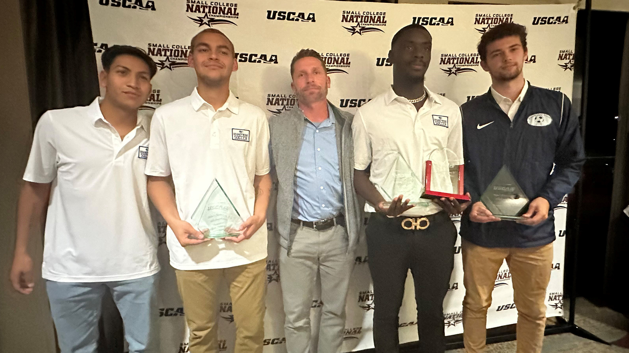 USCAA All-Americans Christian Zavala, Eli DeBooth, Chris Manful and Ray Kelly with head coach Tom Greenawalt