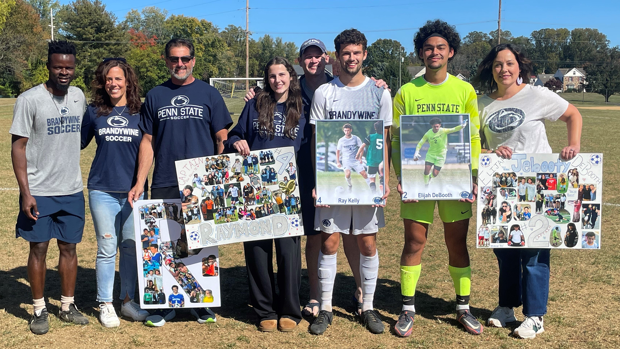 2024 seniors Ray Kelly and Eli DeBooth with families