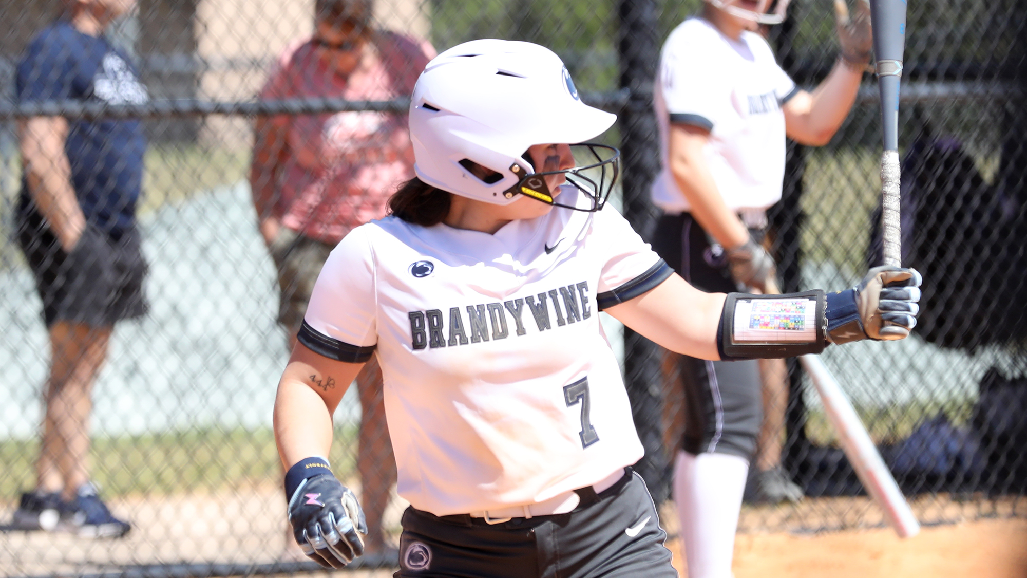 softball player holding bat