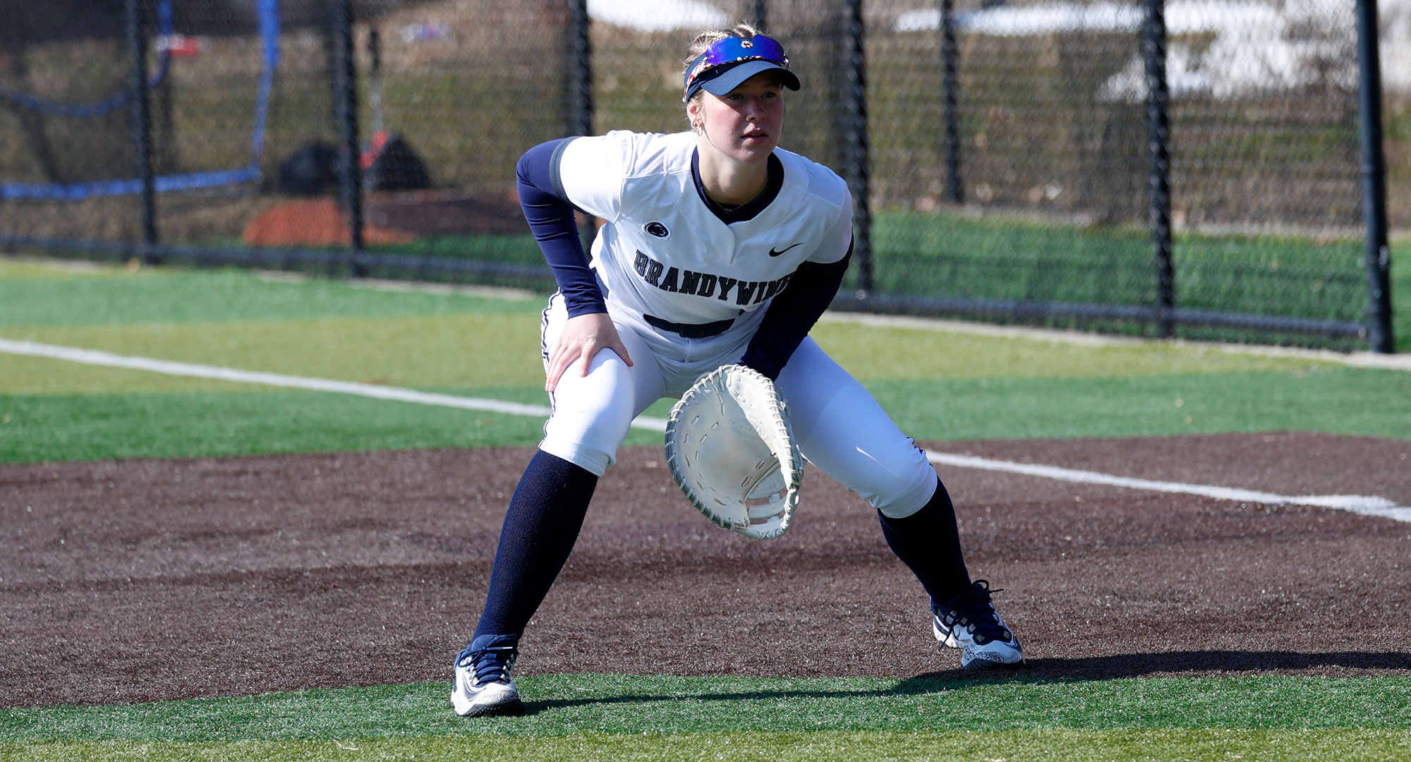 Softball first baseman in defensive stance