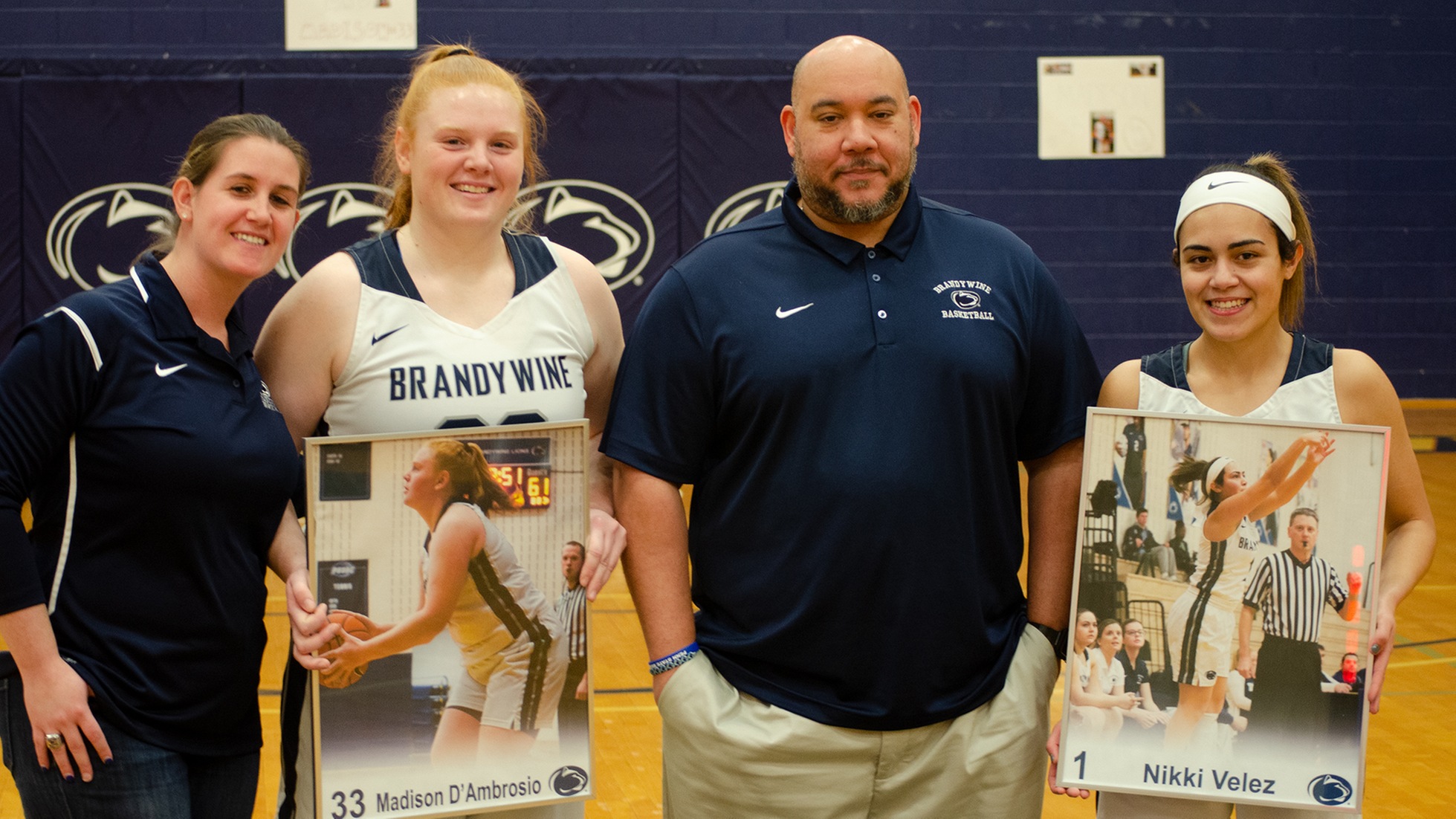 Seniors Madison D'Ambrosio and Nikki Velez with Brandywine AD Bobbi Caprice and Head Coach Larry Johnson