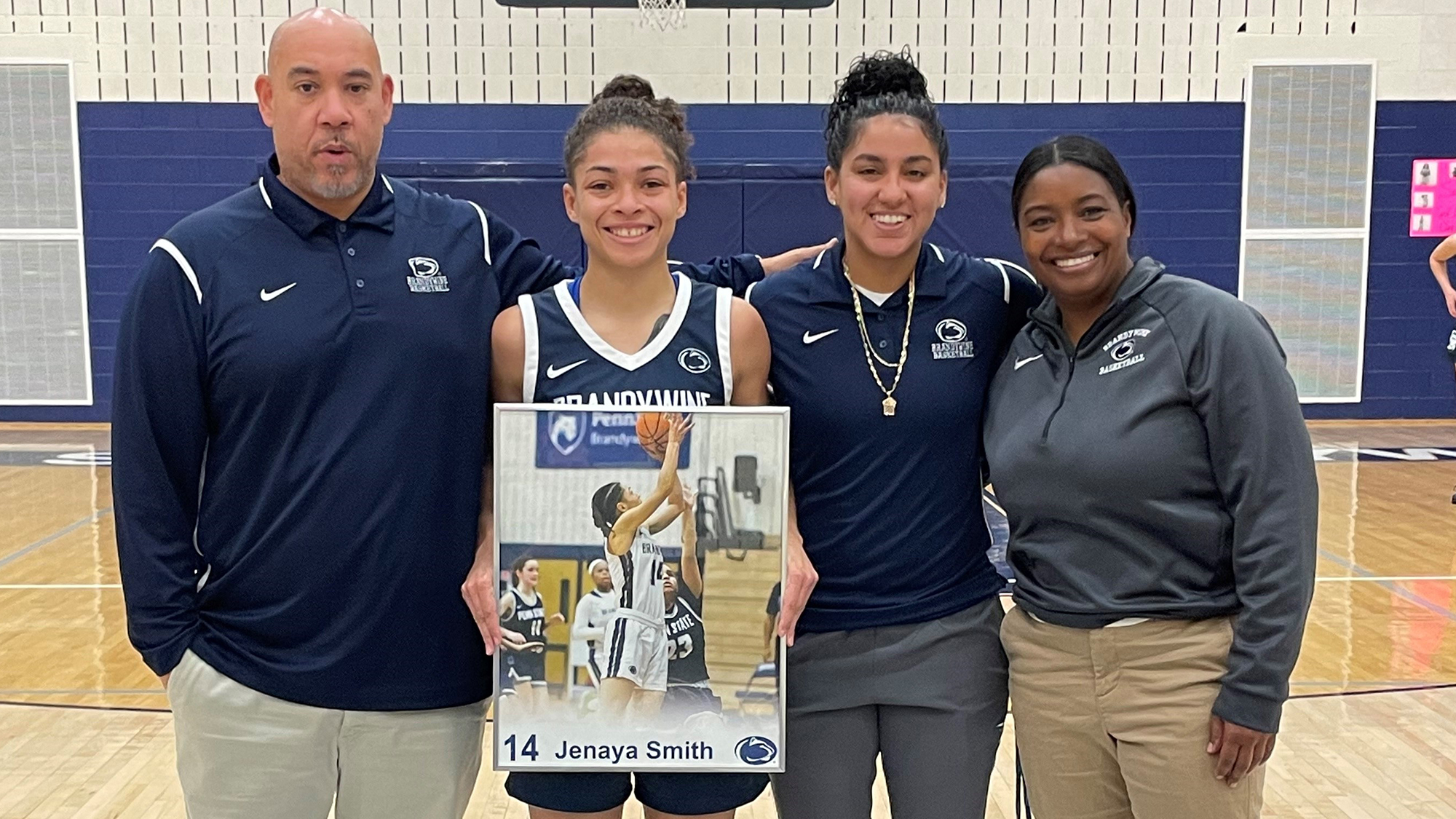 Jenaya Smith with coaches Larry Johnson, Myeisha Matos and Lynelle Mosley