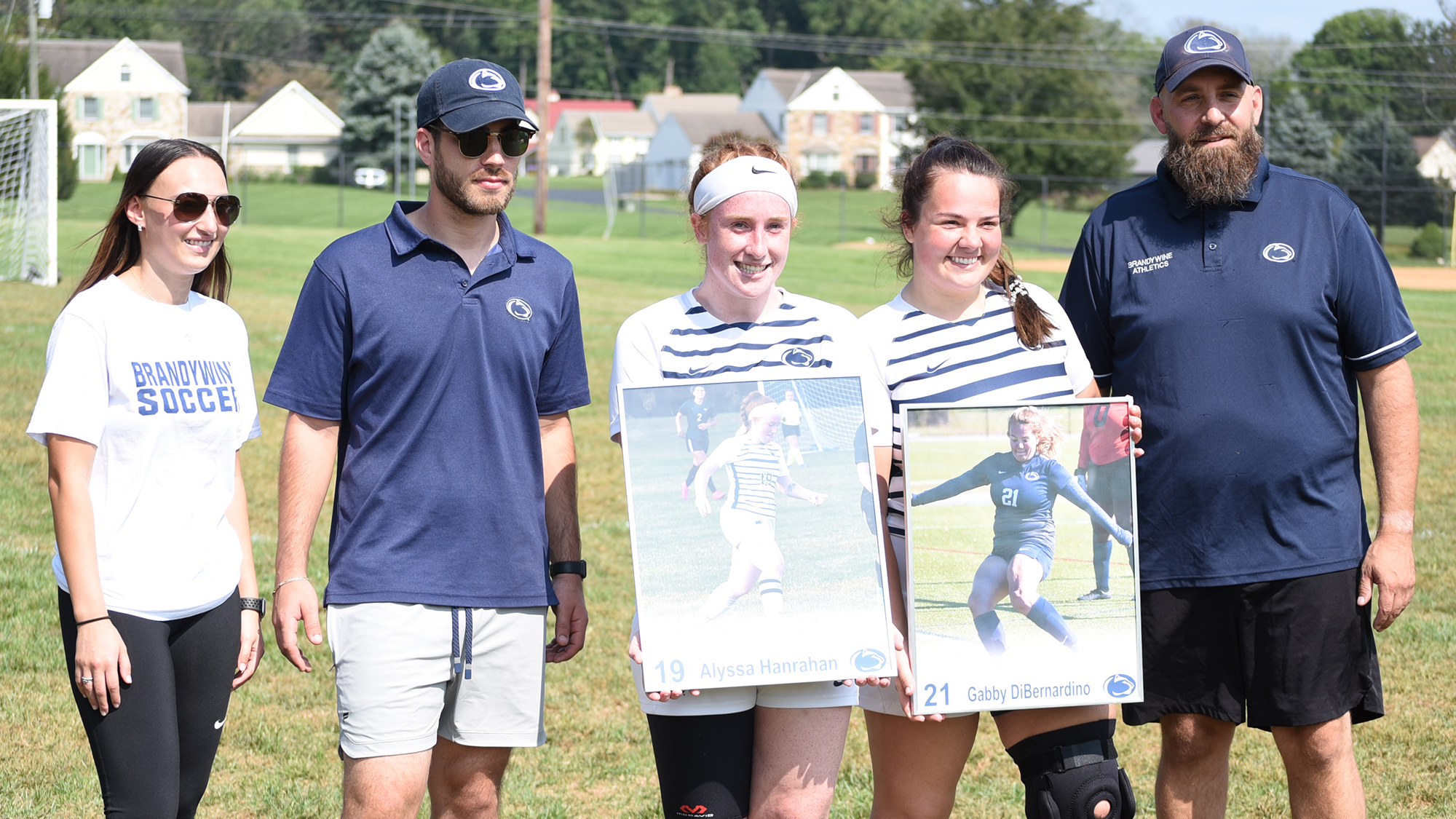 Brandywine seniors Alyssa Hanrahan and Gabby DiBernardino with the Brandywine coaching staff
