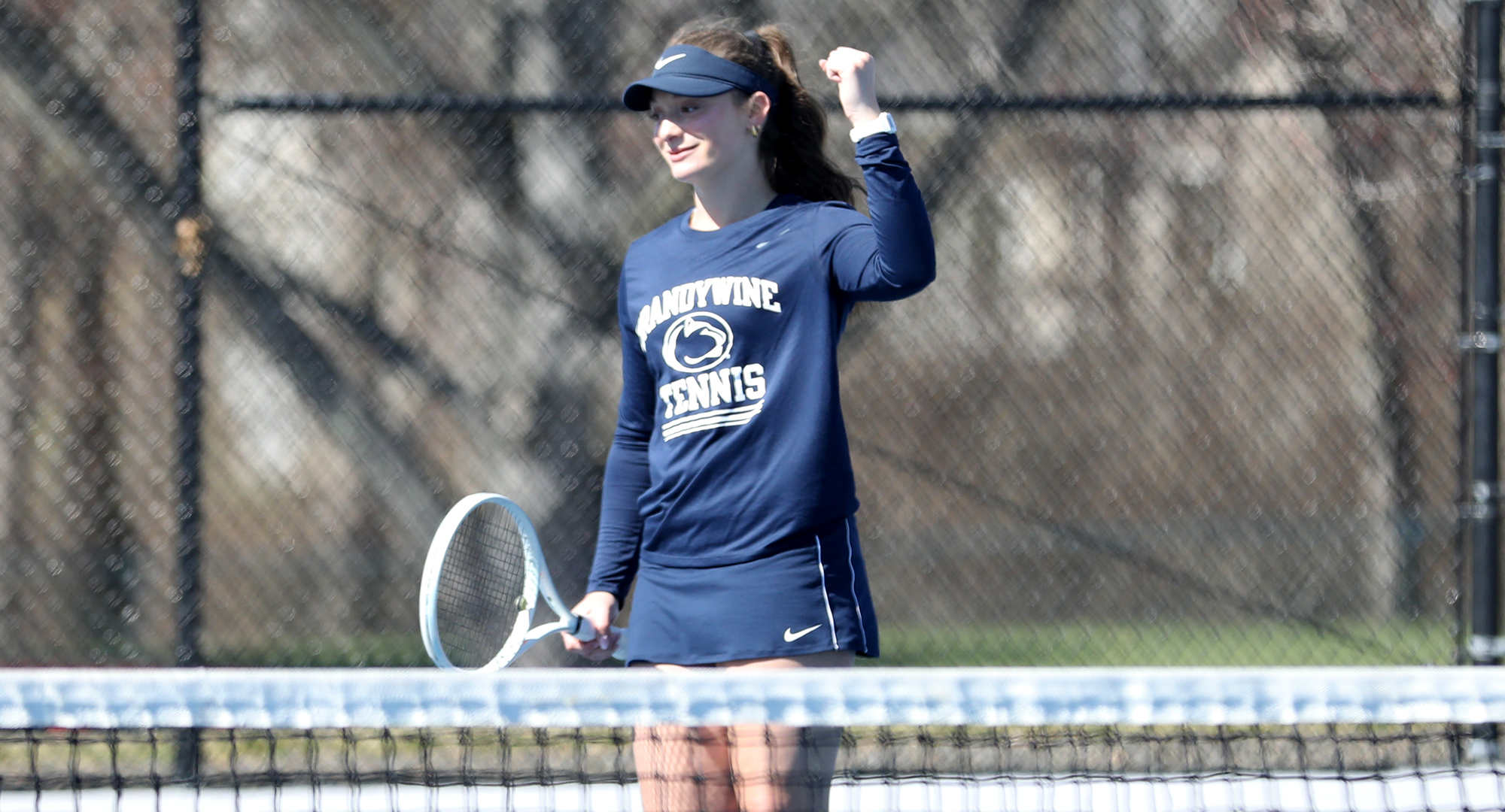 women's tennis player celebrates point
